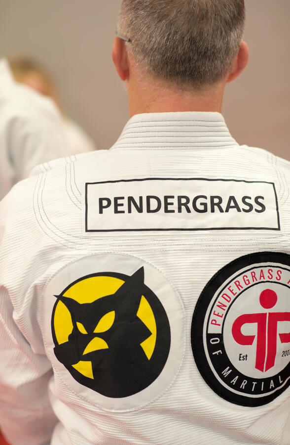 Backside of Gi with school logo visible.