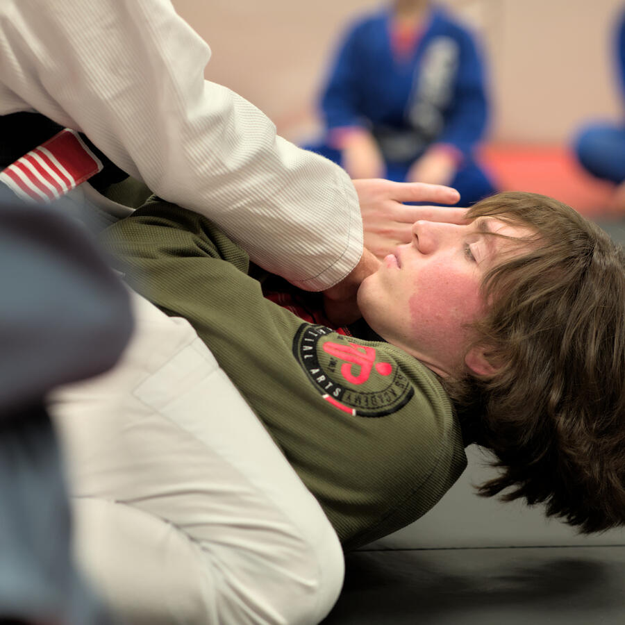 Students getting Jiu Jitsu instruction.