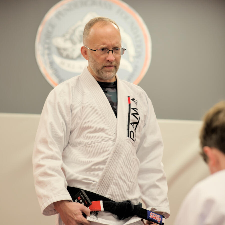 Jiu Jitsu instructor in front of students.